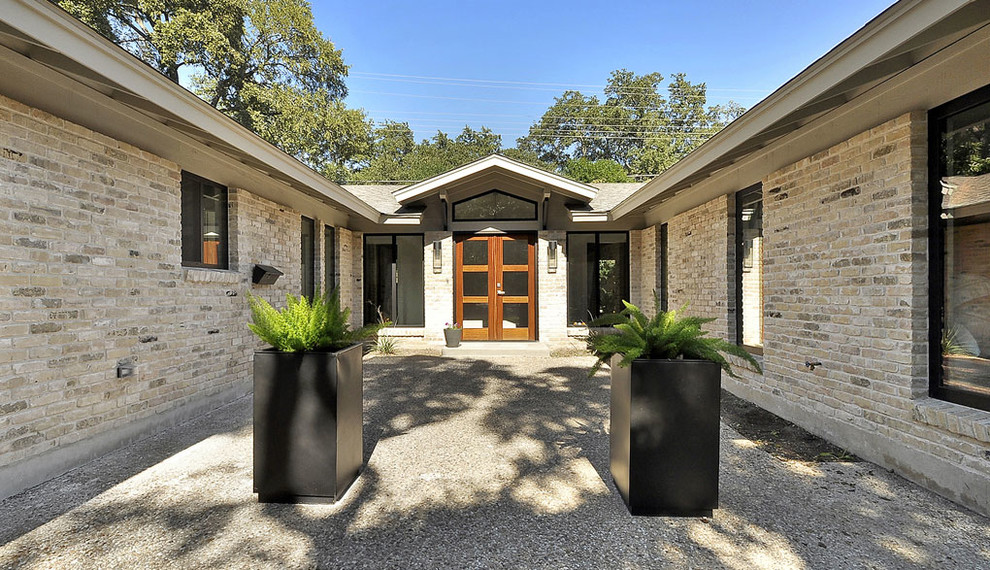 Contemporary front door in Austin with a double front door and a glass front door.
