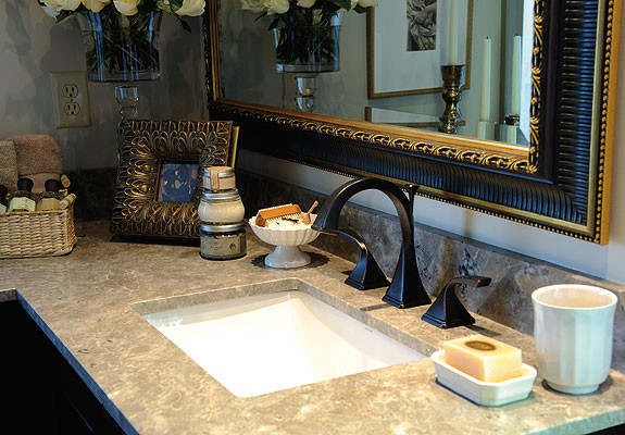 Design ideas for a transitional bathroom in Charlotte with an undermount sink and limestone benchtops.