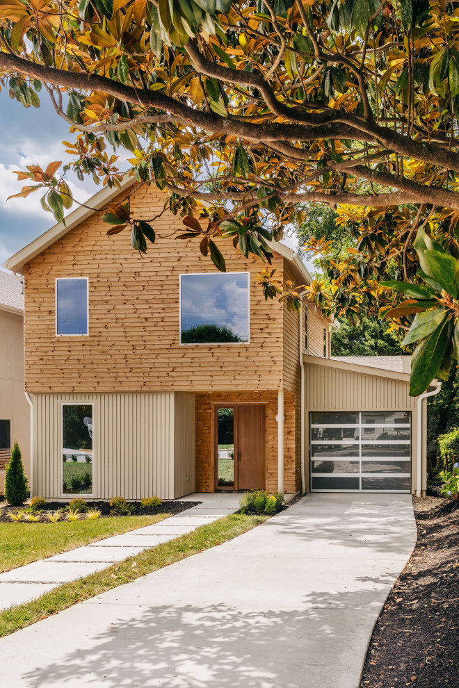 Inspiration for a mid-sized scandinavian beige two-story wood and clapboard gable roof remodel with a shingle roof and a black roof