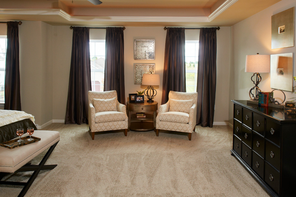 Large transitional master carpeted bedroom photo with beige walls