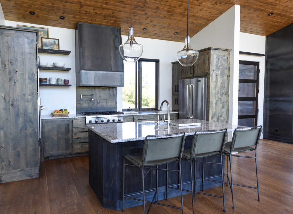 Inspiration for a rustic kitchen remodel with stainless steel appliances