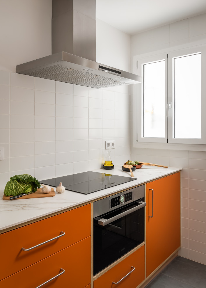 Inspiration for a small retro kitchen in Barcelona with a built-in sink, medium wood cabinets, ceramic flooring, grey floors and white worktops.
