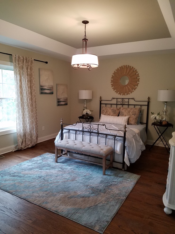 Inspiration for a mid-sized modern master bedroom in Bridgeport with beige walls, medium hardwood floors and no fireplace.