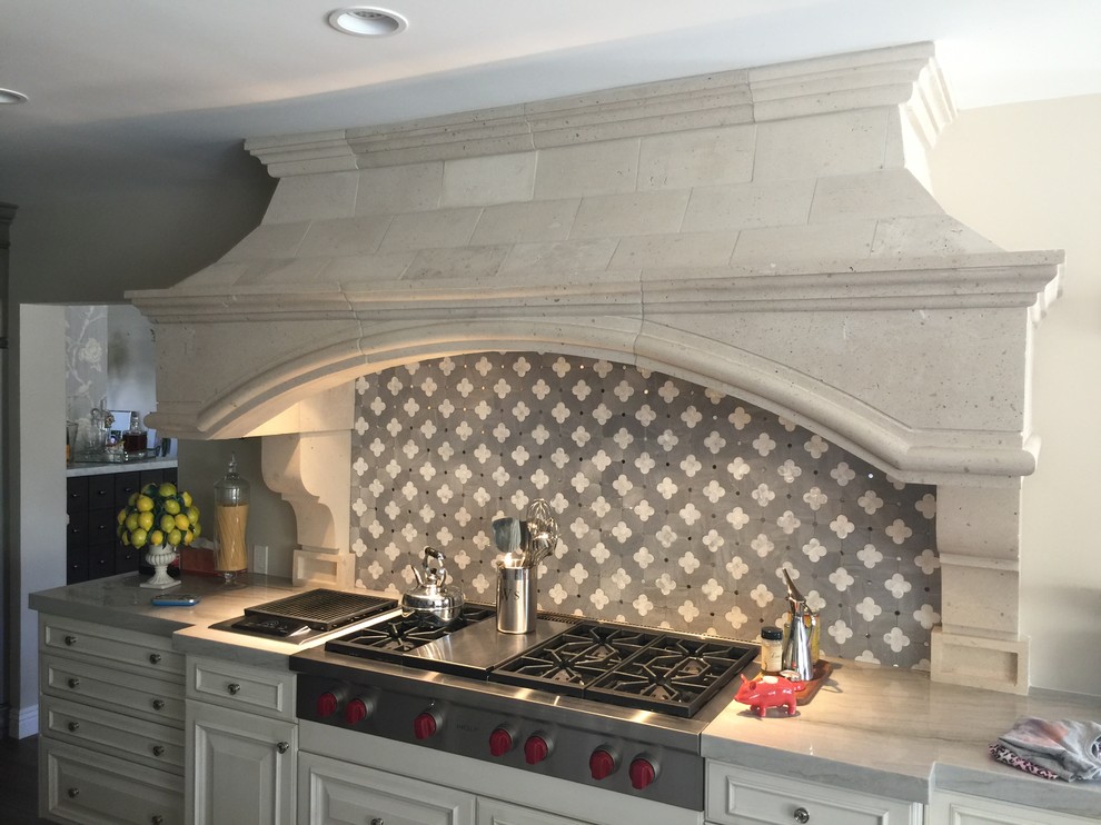 Inspiration for a large transitional dark wood floor and brown floor kitchen remodel in Phoenix with raised-panel cabinets, white cabinets, stainless steel appliances, marble countertops, gray backsplash and stone tile backsplash