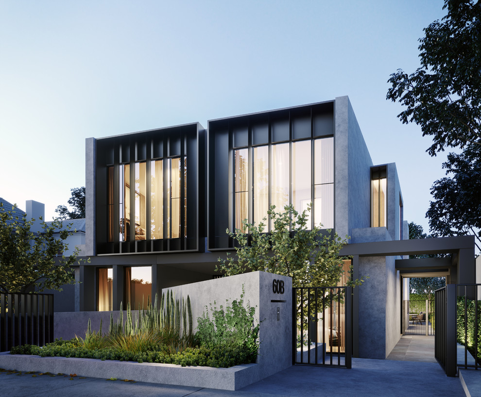 Large contemporary three-storey stucco grey townhouse exterior in Melbourne with a flat roof and a metal roof.