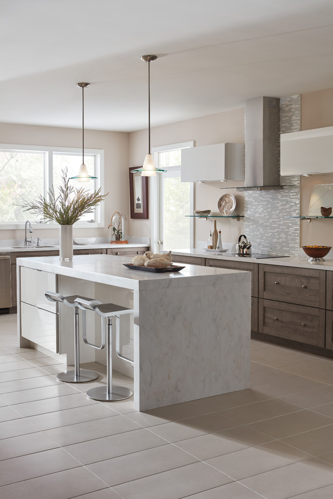 Eat-in kitchen - mid-sized transitional l-shaped porcelain tile eat-in kitchen idea in New York with a double-bowl sink, shaker cabinets, distressed cabinets, marble countertops, multicolored backsplash, glass tile backsplash, stainless steel appliances and an island