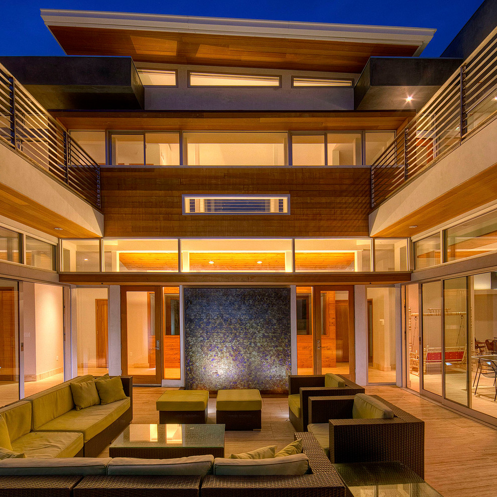 Inspiration for a contemporary courtyard patio in Los Angeles with a fire feature.