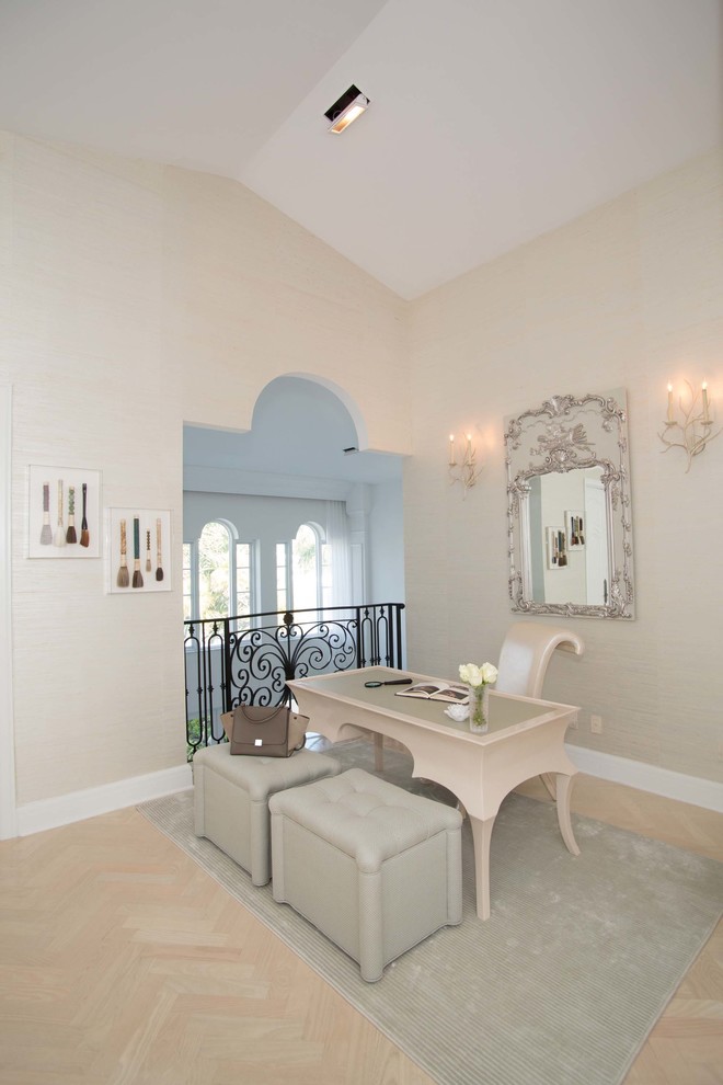 Inspiration for a transitional home office in Miami with beige walls and beige floor.