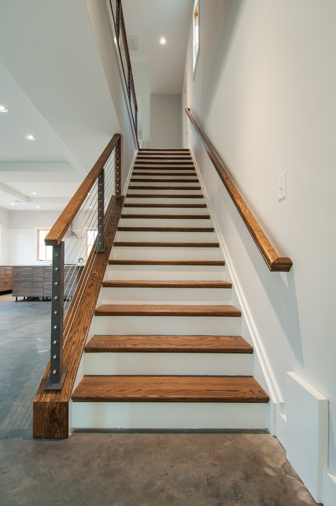 Mid-sized country wood straight staircase in Richmond with wood risers and cable railing.