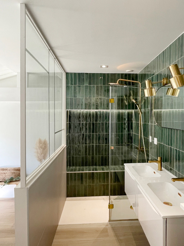 This is an example of a mid-sized scandinavian 3/4 bathroom in Bordeaux with green tile, white walls, an integrated sink, solid surface benchtops, a hinged shower door, white benchtops, a shower seat, a double vanity, a floating vanity, flat-panel cabinets, white cabinets, a curbless shower, ceramic tile, wood-look tile and beige floor.