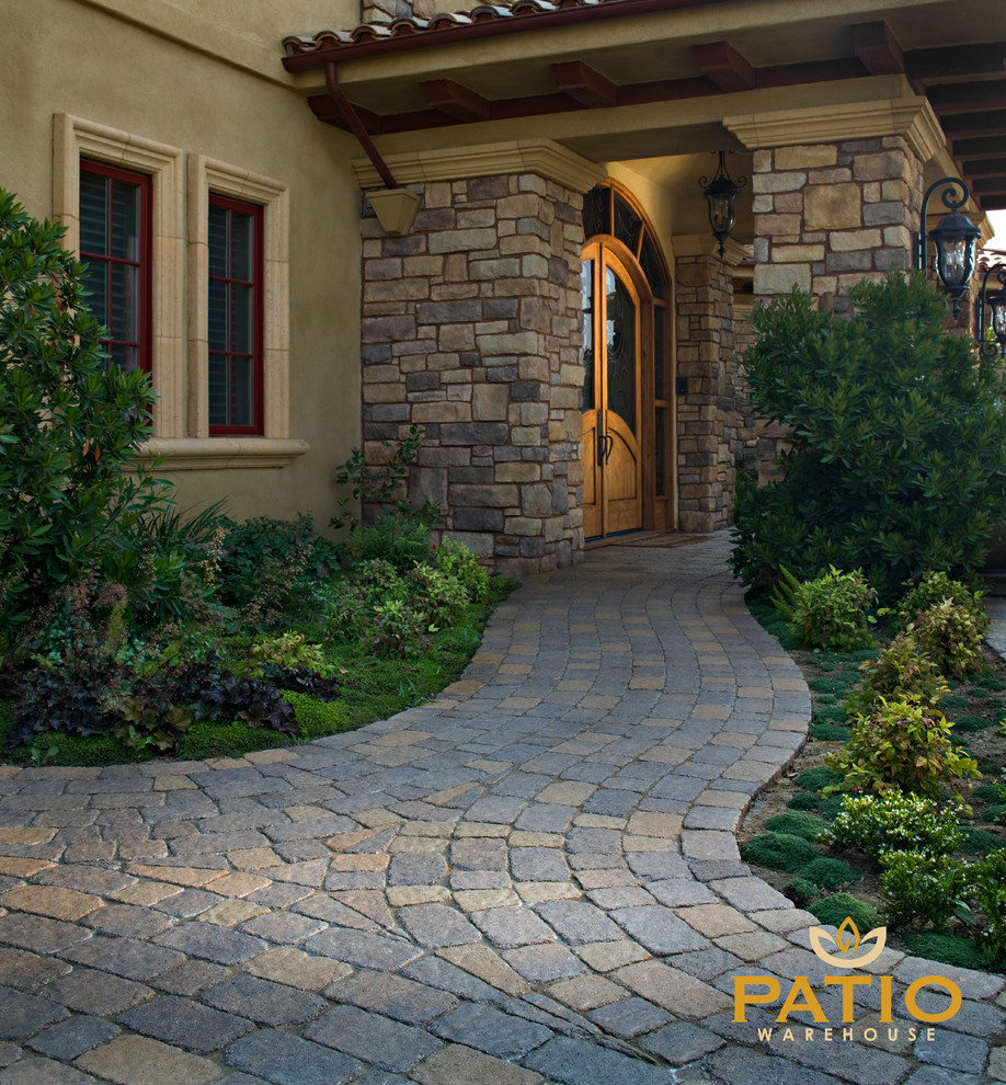 Inspiration for a country backyard patio in Orange County with concrete pavers.