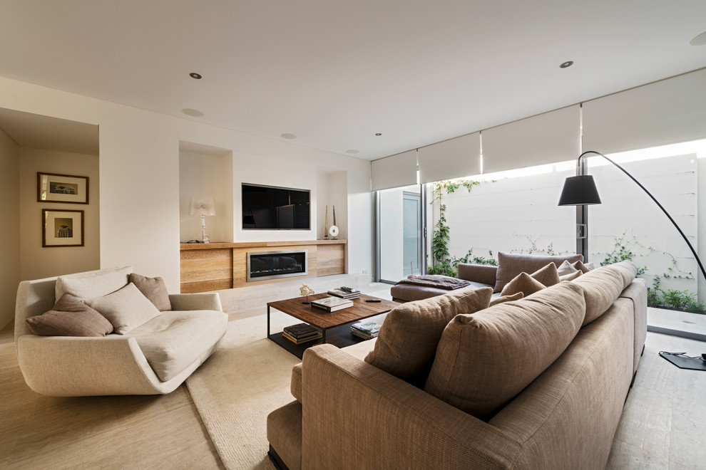 Design ideas for a large contemporary open concept living room in Perth with white walls, light hardwood floors, a ribbon fireplace and a wall-mounted tv.