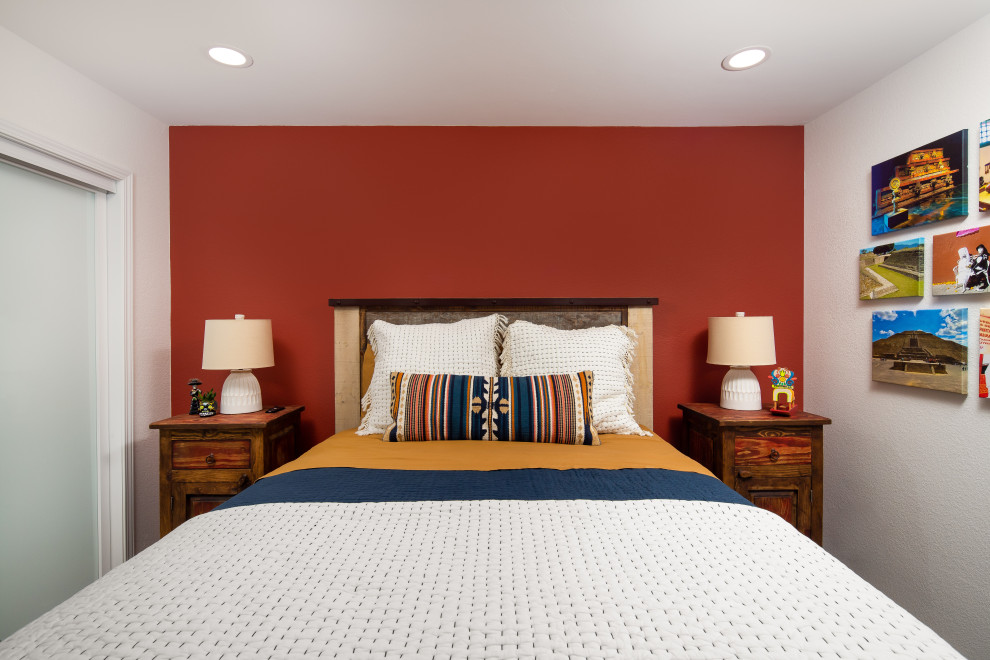 Medium sized coastal gender neutral kids' bedroom in San Diego with red walls, light hardwood flooring and brown floors.