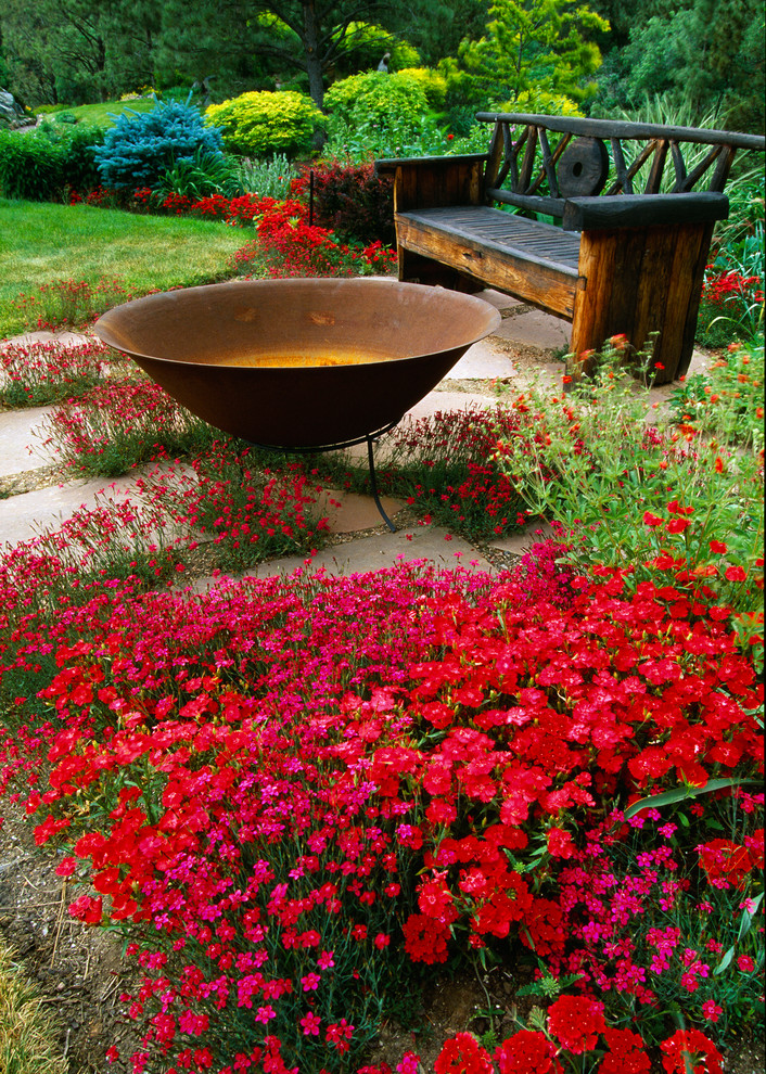 Inspiration for a country garden in Denver with a fire feature.
