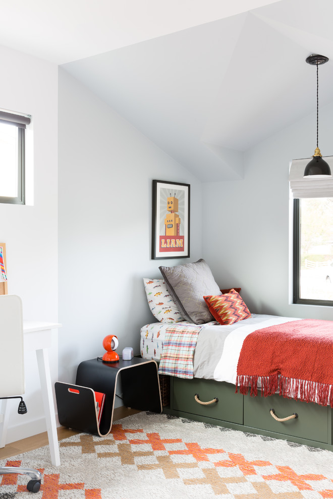 Kids' room - transitional boy medium tone wood floor kids' room idea in San Francisco with white walls