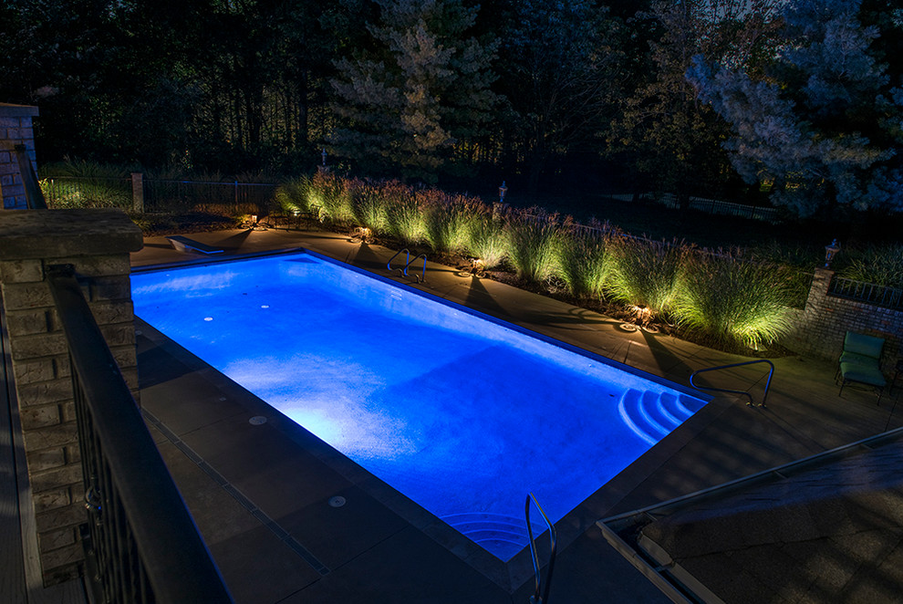 Inspiration for a mid-sized backyard concrete and rectangular pool remodel