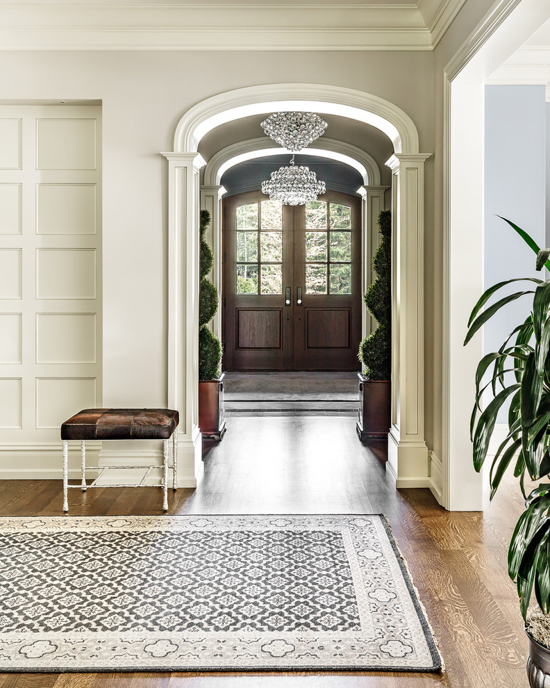 Large transitional foyer in Chicago with grey walls, medium hardwood floors, a double front door, a medium wood front door and brown floor.
