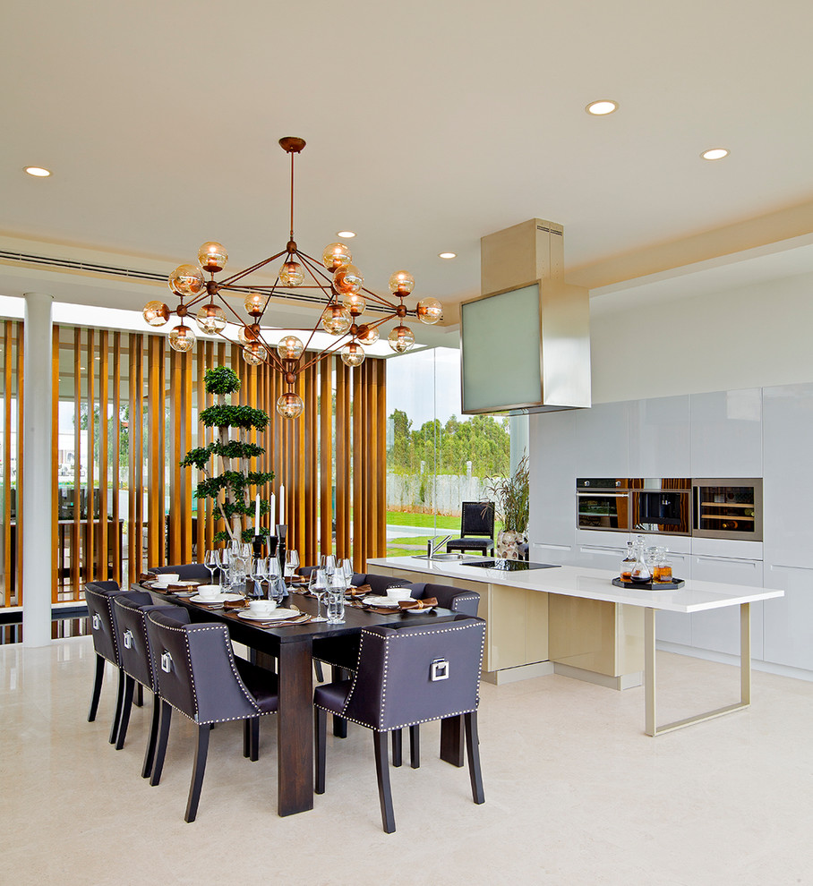 Mid-sized contemporary dining room in Bengaluru with white walls and beige floor.