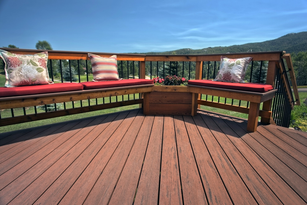 Example of a mid-sized arts and crafts backyard deck design in Denver with no cover