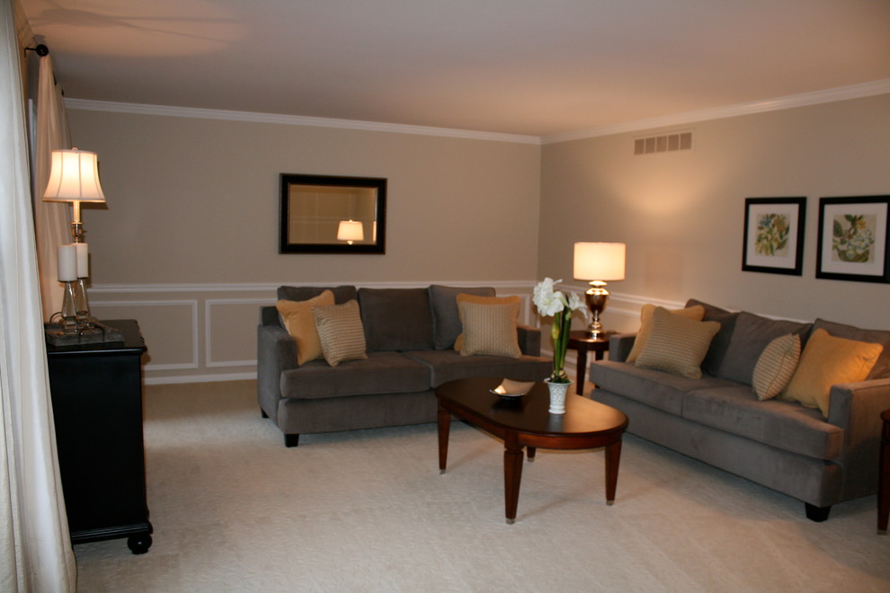 This is an example of a mid-sized contemporary formal enclosed living room in Philadelphia with beige walls, carpet, no fireplace and beige floor.