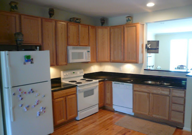 Example of a transitional kitchen design in DC Metro with beaded inset cabinets, light wood cabinets and an island