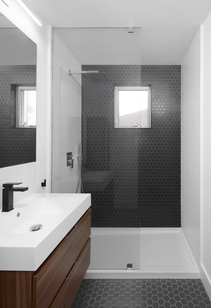 Photo of a contemporary bathroom in Toronto with flat-panel cabinets, dark wood cabinets, an alcove shower, black tile, mosaic tile, white walls, mosaic tile floors, a console sink, black floor and an open shower.