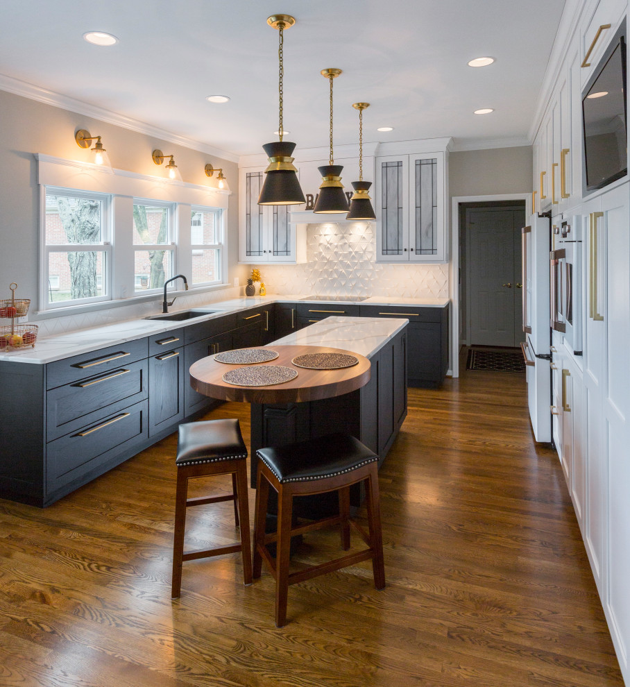 Eat-in kitchen - mid-sized transitional medium tone wood floor and brown floor eat-in kitchen idea in Cincinnati with an undermount sink, recessed-panel cabinets, quartz countertops, white backsplash, ceramic backsplash, white appliances, an island and white countertops