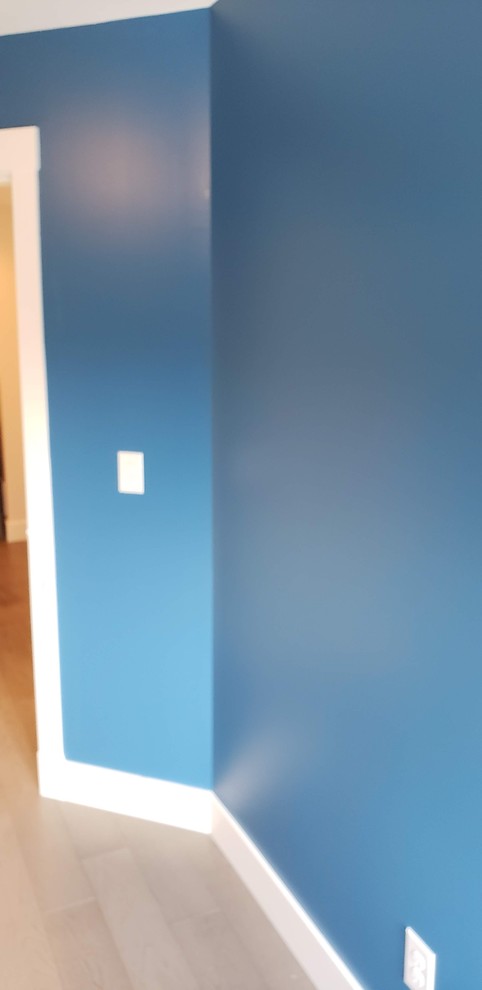 Example of a transitional home design design in Vancouver