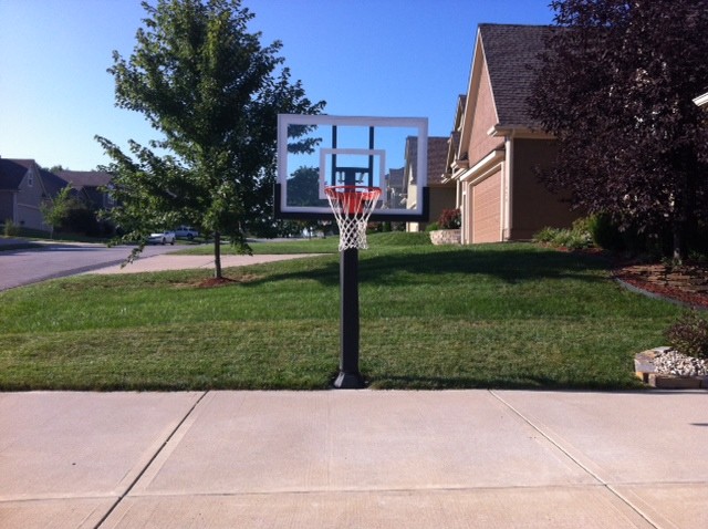 Inspiration for a large traditional full sun front yard concrete paver outdoor basketball/tennis/multi-game court in Kansas City.