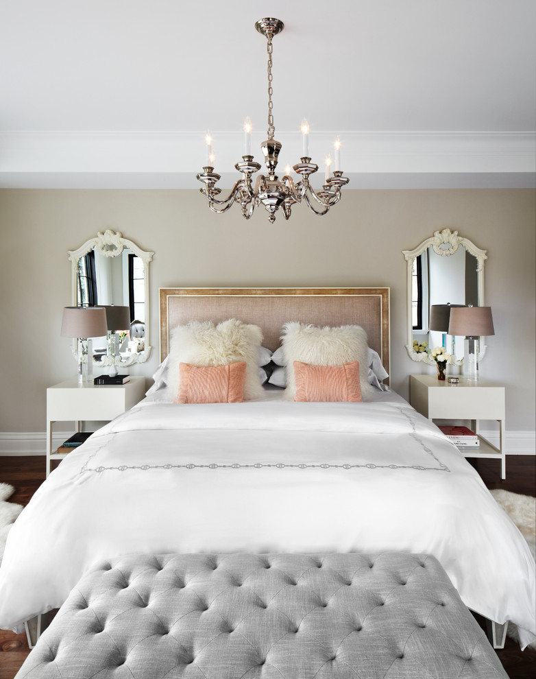 This is an example of a traditional master bedroom in Toronto with beige walls.