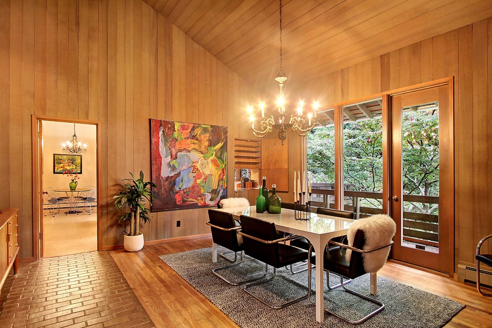 Mid-sized midcentury open plan dining in Seattle with brown walls, medium hardwood floors and brown floor.