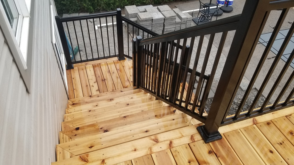 Photo of a large modern back first floor metal railing terrace in Ottawa with no cover.