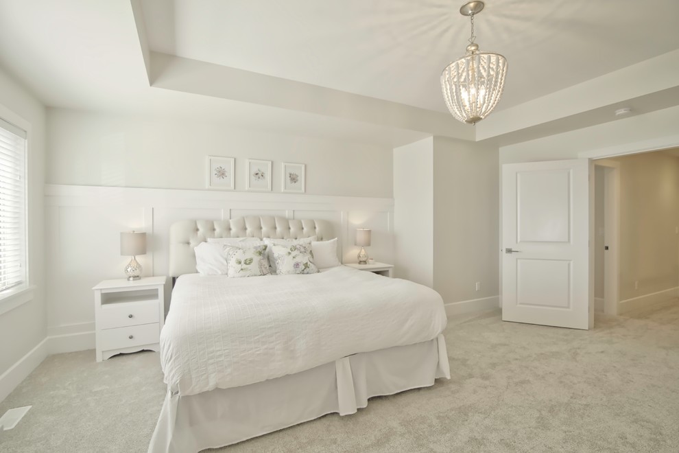Inspiration for a large contemporary master bedroom in Vancouver with white walls and carpet.