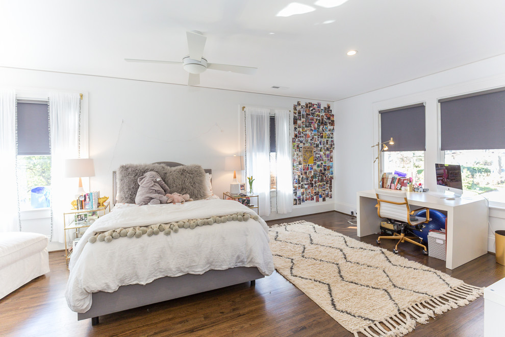 This is an example of a large eclectic bedroom in Charlotte with white walls, dark hardwood floors and no fireplace.
