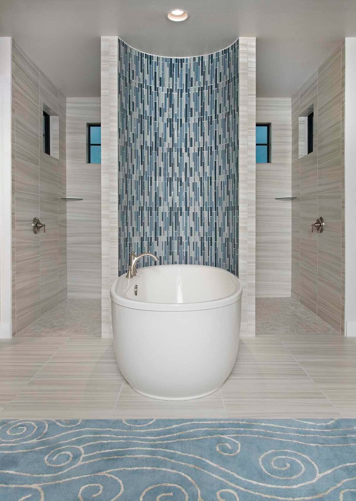 Photo of a large beach style master bathroom in Miami with beaded inset cabinets, white cabinets, a freestanding tub, a curbless shower, beige walls, an undermount sink, an open shower and beige floor.