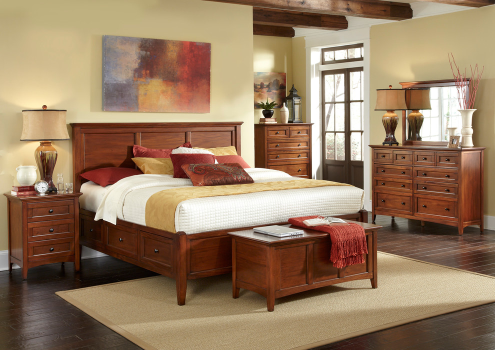 Inspiration for a mid-sized traditional master bedroom in Los Angeles with beige walls and dark hardwood floors.