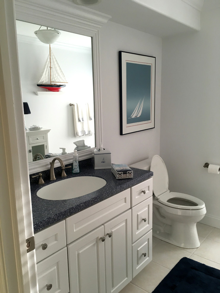 Small beach style 3/4 bathroom in Philadelphia with shaker cabinets, white cabinets, white walls, a drop-in sink, engineered quartz benchtops and marble.