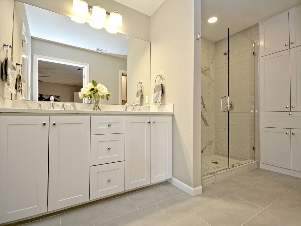 Inspiration for a mid-sized transitional master white tile and porcelain tile porcelain tile double shower remodel in Austin with shaker cabinets, white cabinets, gray walls, an undermount sink and quartzite countertops