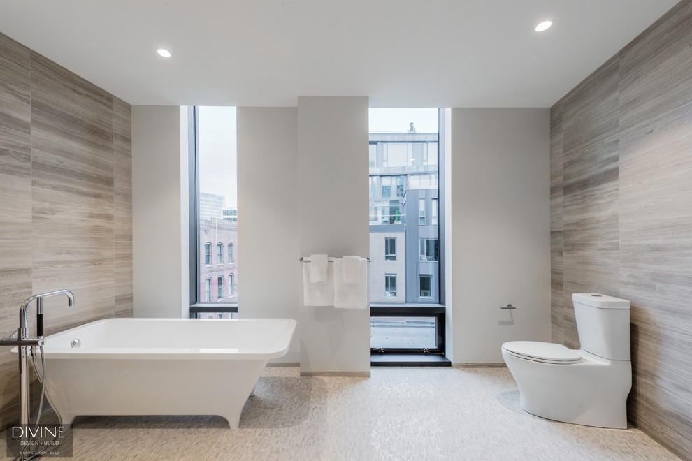 Inspiration for a large contemporary 3/4 bathroom in Boston with flat-panel cabinets, light wood cabinets, an open shower, a two-piece toilet, gray tile, ceramic tile, grey walls, ceramic floors, an integrated sink, engineered quartz benchtops, grey floor and an open shower.