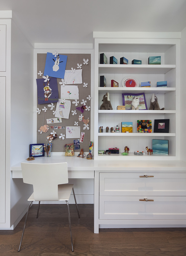 This is an example of a contemporary kids' room for girls in San Francisco with white walls and dark hardwood floors.