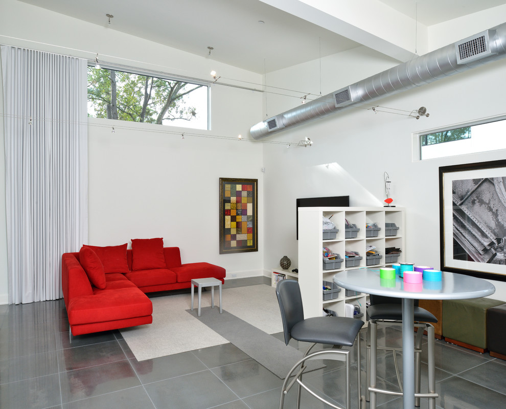 Modern open concept family room in Houston with white walls.