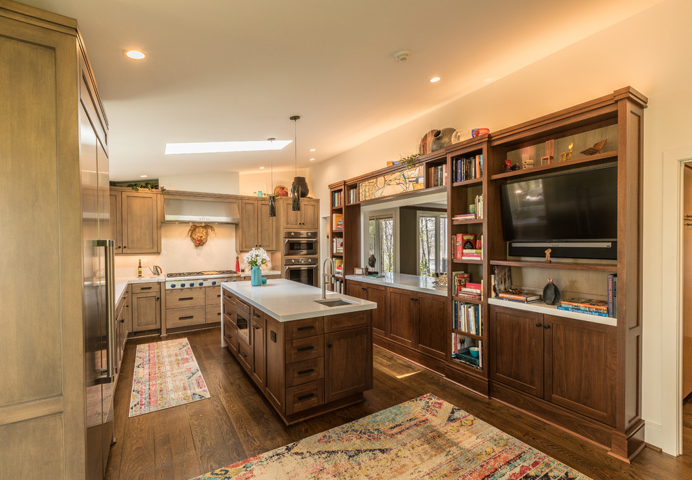 Inspiration for a mid-sized transitional u-shaped open plan kitchen in Other with shaker cabinets, medium wood cabinets, with island, brown floor, an undermount sink, quartz benchtops, stainless steel appliances, dark hardwood floors and beige benchtop.