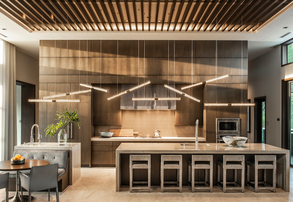 Inspiration for a contemporary kitchen in New York with a single-bowl sink, flat-panel cabinets, dark wood cabinets, beige splashback, stainless steel appliances, multiple islands, beige floor and white benchtop.