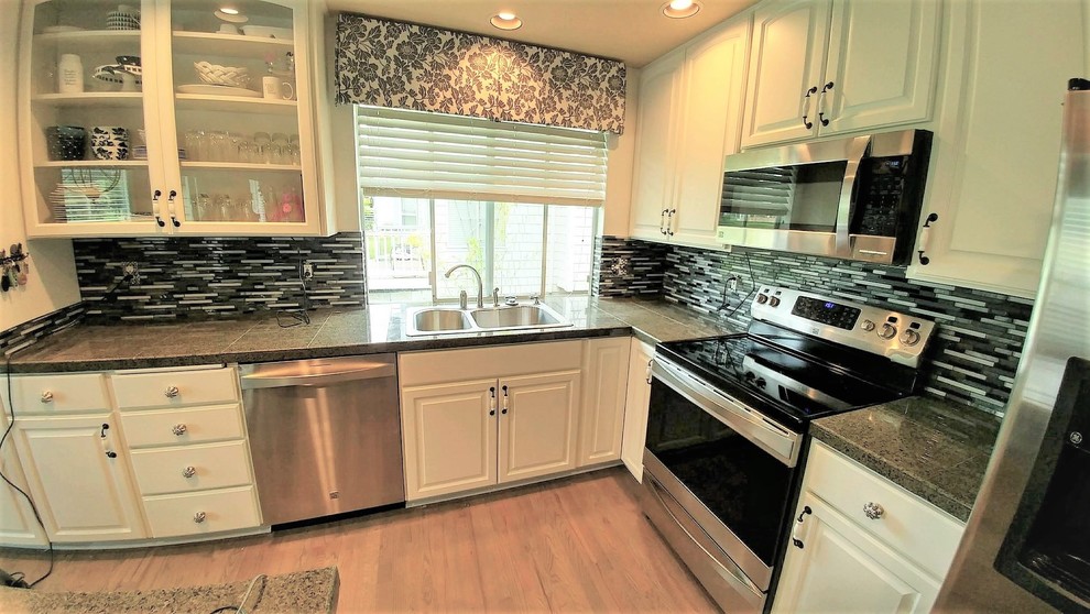Kitchen photo in Seattle with multicolored backsplash