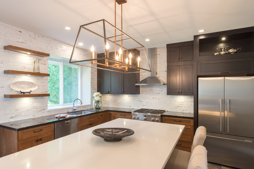 Kitchen pantry - large transitional slate floor and multicolored floor kitchen pantry idea in Vancouver with an undermount sink, shaker cabinets, dark wood cabinets, quartz countertops, white backsplash, porcelain backsplash, stainless steel appliances, an island and white countertops