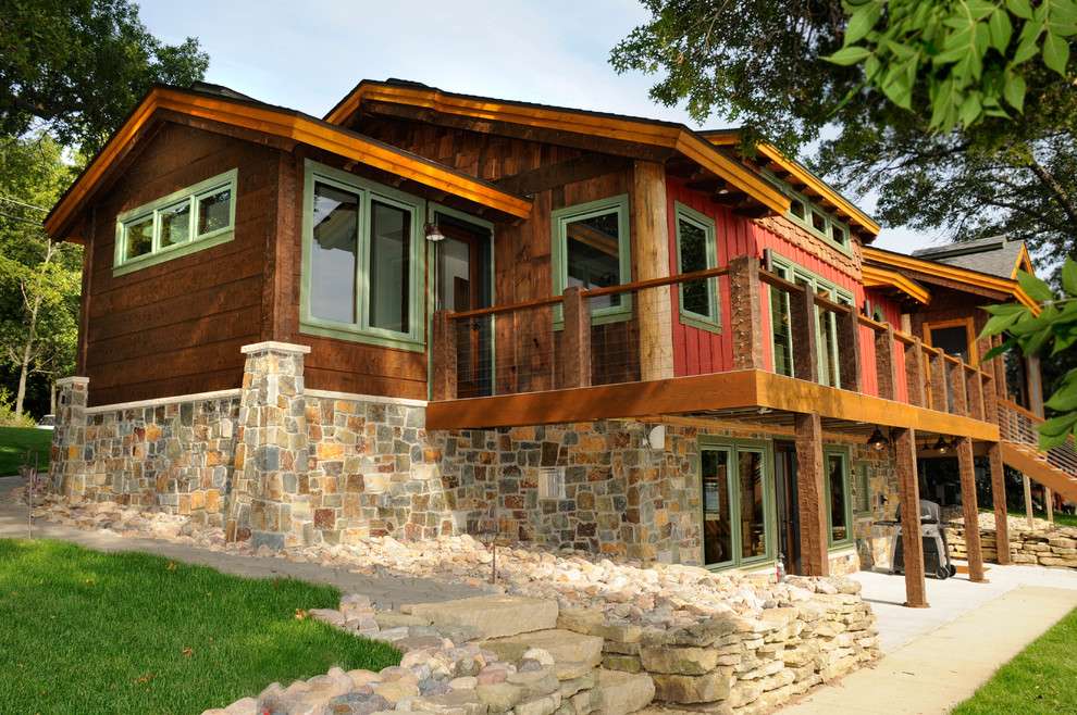 Example of a mountain style brown two-story wood exterior home design