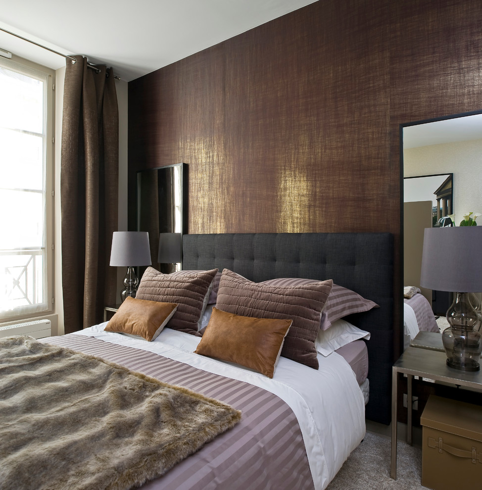 Contemporary bedroom in Paris with brown walls and carpet.
