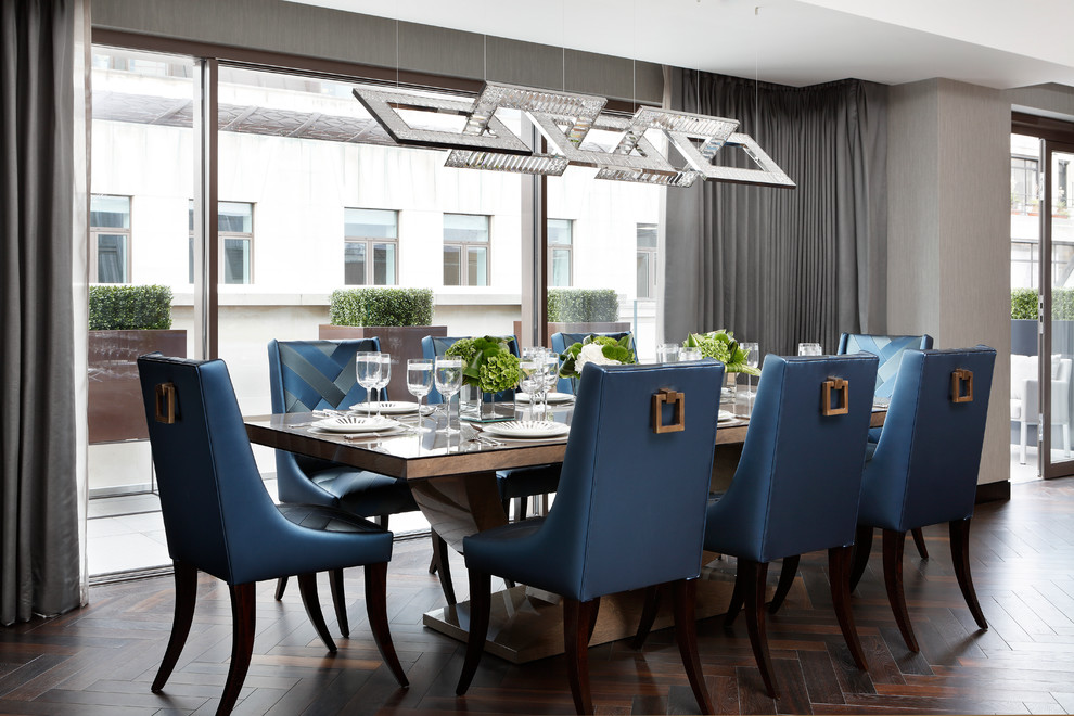 Inspiration for a large contemporary dining room in London with grey walls and dark hardwood floors.