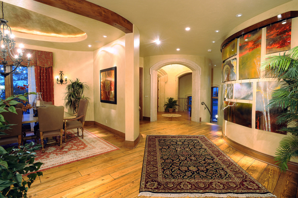 Foyer - large transitional medium tone wood floor foyer idea in Austin with beige walls and a medium wood front door