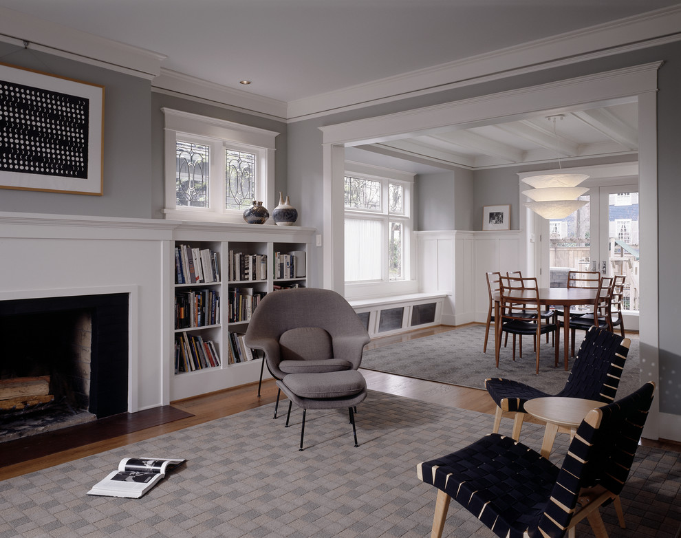 This is an example of a mid-sized traditional formal living room in Seattle with grey walls, medium hardwood floors, a standard fireplace and no tv.
